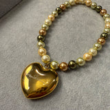 THE MONA SHELL PEARL NECKLACE WITH GOLD HEART SIGNATURE